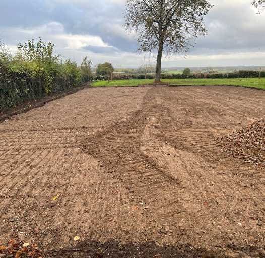 Egaliseren van de grond voor nieuwe aanleg